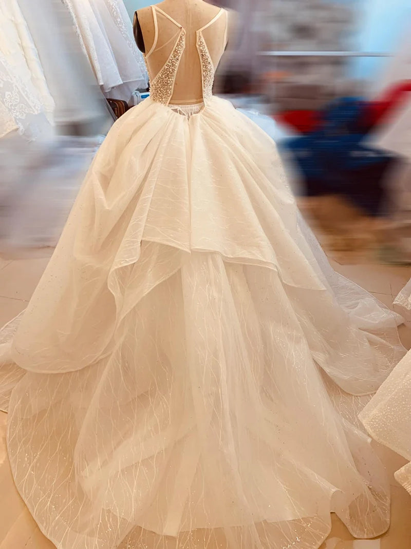 Charming Ball Gown Wedding Dresses Spaghetti Pearls Sequins Backless Sweep Train Tulle Bridal Gowns Custom Made