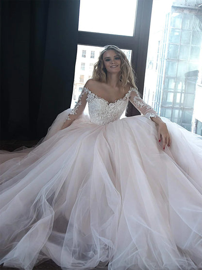 Charming A-Line Wedding Dresses Sweetheart Buttons Appliques Beads Illusion Long Sleeves Sweep Train Tulle Bridal Gowns For Women