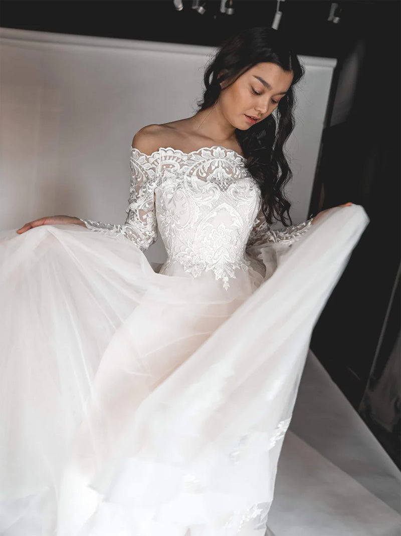 Elegant A-Line Wedding Dresses Off The Shoulder Lace Appliques Beads Long Sleeves Sweep Train Covered Buttons Tulle Bridal Gowns Custom Made