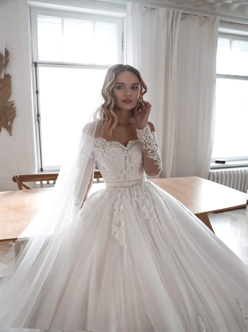 Luxurious Ball Gown Wedding Dresses Off The Shoulder Beads Appliques Belt Illusion Long Sleeves Tulle Court Train Bridal Gowns Custom Made