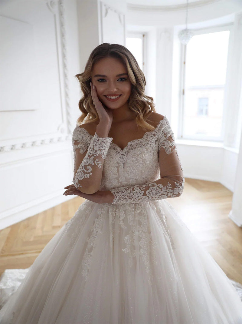 Luxurious Ball Gown Wedding Dresses Off The Shoulder Beads Appliques Belt Illusion Long Sleeves Tulle Court Train Bridal Gowns Custom Made