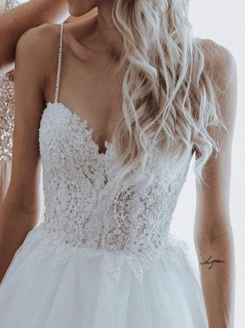 Modern Ball Gown Wedding Dresses Spaghetti Beads Appliqued Backless Sleeveless Sweep Train Tulle Bridal Gowns Custom Made