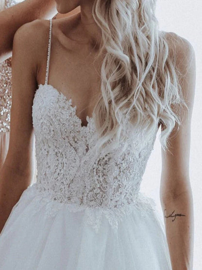 Modern Ball Gown Wedding Dresses Spaghetti Beads Appliqued Backless Sleeveless Sweep Train Tulle Bridal Gowns Custom Made