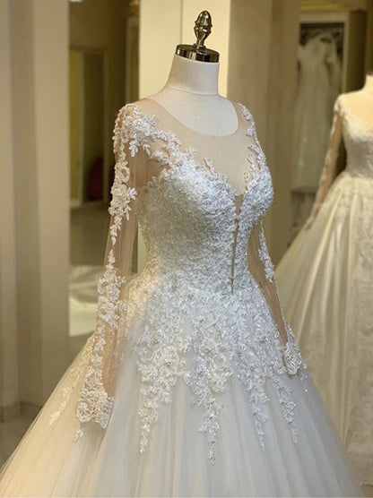 Charming Ball Gown Wedding Dresses Illusion Scoop Long Sleeves Appliqued Beads Tulle Sweep Train Bridal Gowns Custom Made